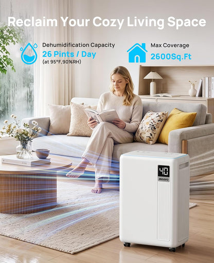 26-pint dehumidifier, dehumidifier for basement with drain hose shown in use